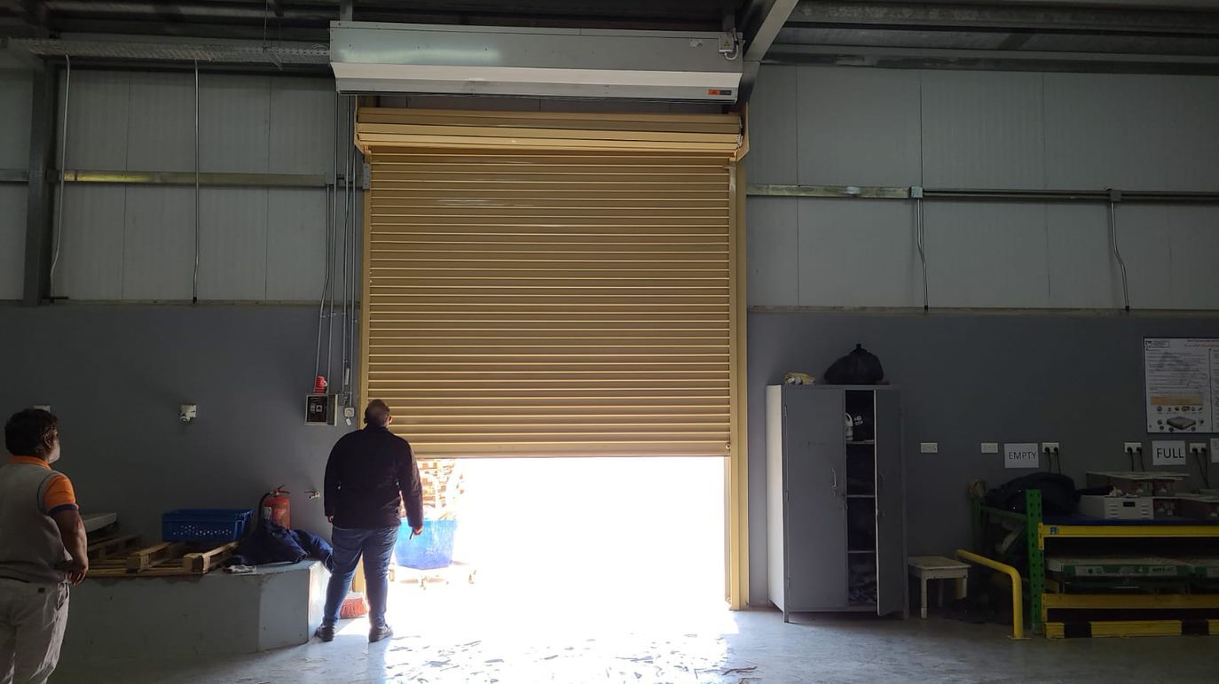 Staffoclima team during installation of air curtains